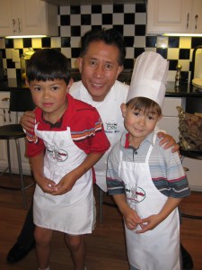 Martin Yan with two of his youngest apprentices.